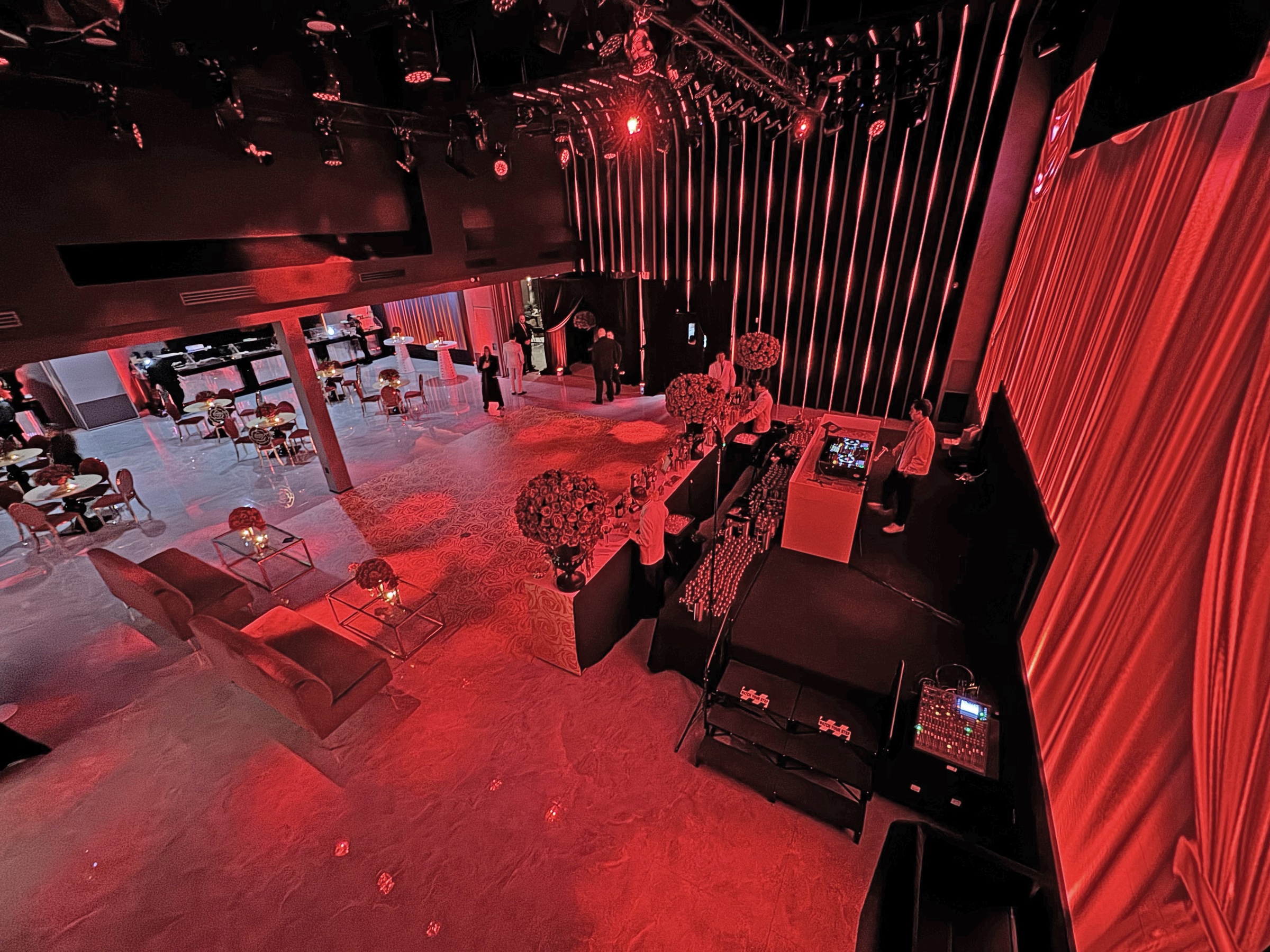 Overhead view of the Lounge X event hall showing the bar, lounge seating, and reception layout